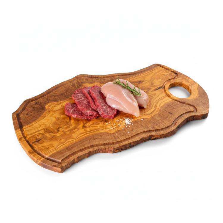 Irregular shape olive wood chopping board with handle and groove displaying fresh meat